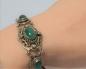 Preview: Antikschmuck Schmucksteinarmband mit grünen Steinen, Tombak, Länge: 19,5 cm