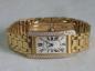 Preview: Cartier Tank Americaine Large, Damenuhr aus 750er Gold mit 99 Diamanten