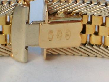 Neuwertiges Armband aus 750er Gelb und Weißgold mit Smaragden, Borkenglieder, Länge 19,0 cm, Gewicht: 35,2g