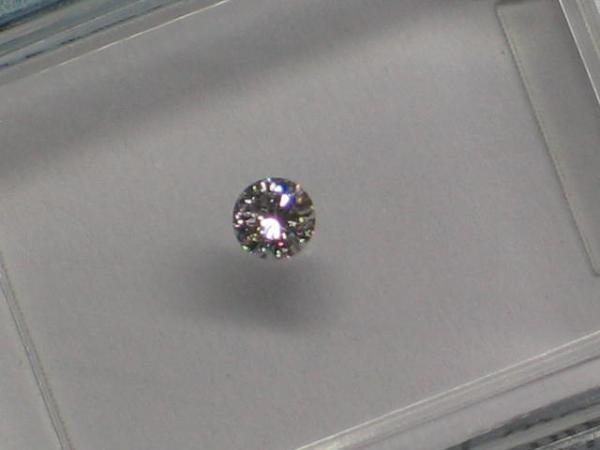 Diamant im Brillantschliff 0.08 ct/ G/ SI2/ G/ VG/ G/ N mit IGI Report