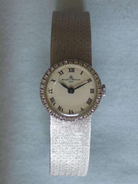 Diamantuhr Baume & Mercier aus 750er Weißgold mit Diamantlünette, Länge 16,5 cm