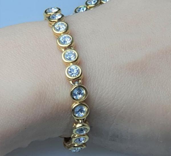 Elegantes Tennisarmband mit Schmucksteinen, vergoldet, Länge 19 cm